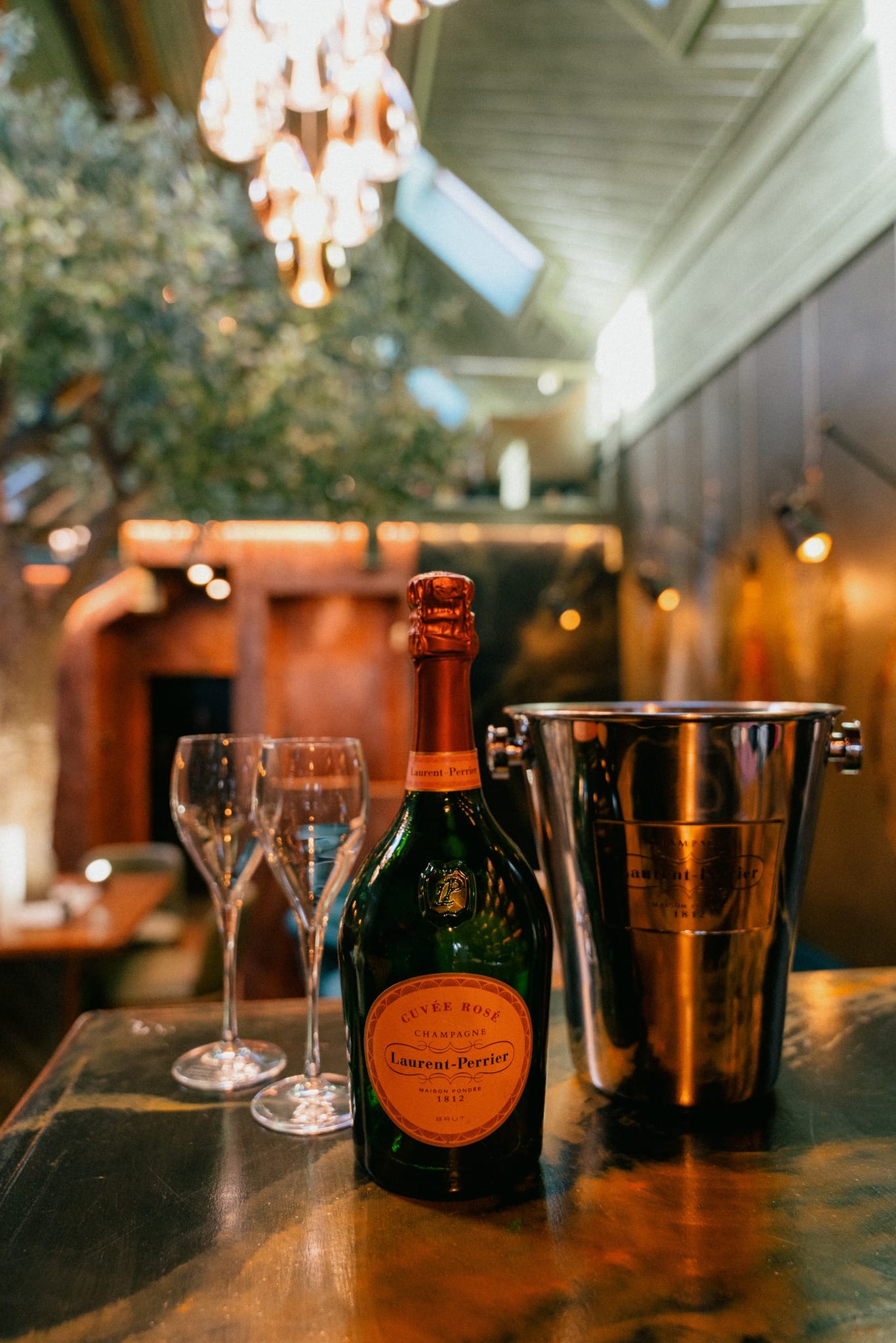 Laurent-Perrier Champagne with glasses and ice bucket